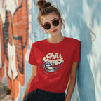 Woman wearing Chill Vibes sloth t-shirt leaning on a wall with sunglasses and messy bun