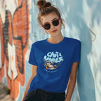 Woman wearing Chill Vibes sloth t-shirt leaning on a wall with sunglasses and messy bun